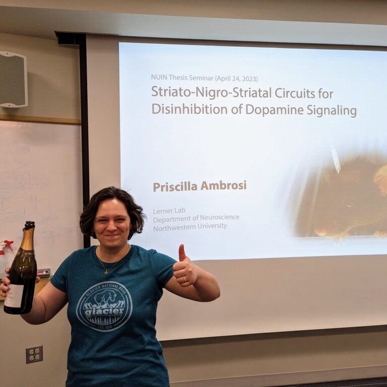 priscilla with champagne at her thesis defense